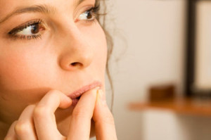 Woman biting nails